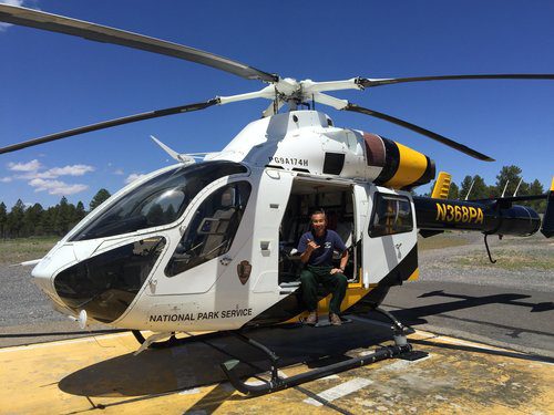 ANDY SHAKAS FROM A HELICOPTER. “WORKING WITH THE HELITACK CREWS IS SOMETHING I’LL ALWAYS REMEMBER.” PHOTO: ANDY KIKUTA.